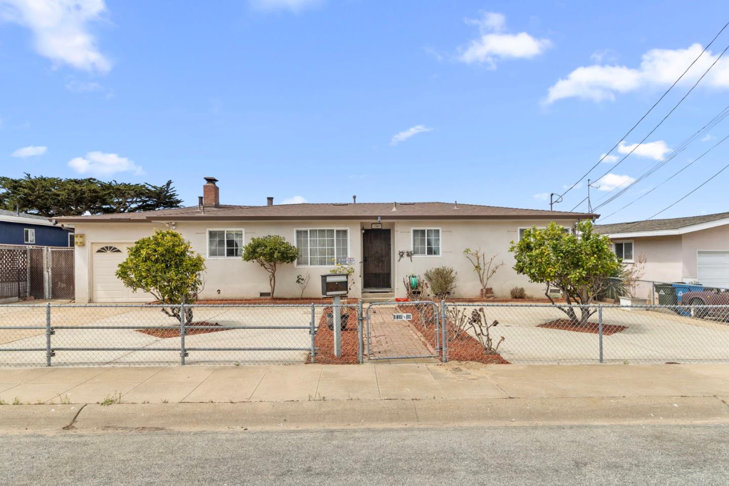 1949 Lincoln Street Seaside, CA 93955 - Photo 4 of 40 a view of a patio with couches and table and chairs with wooden fence