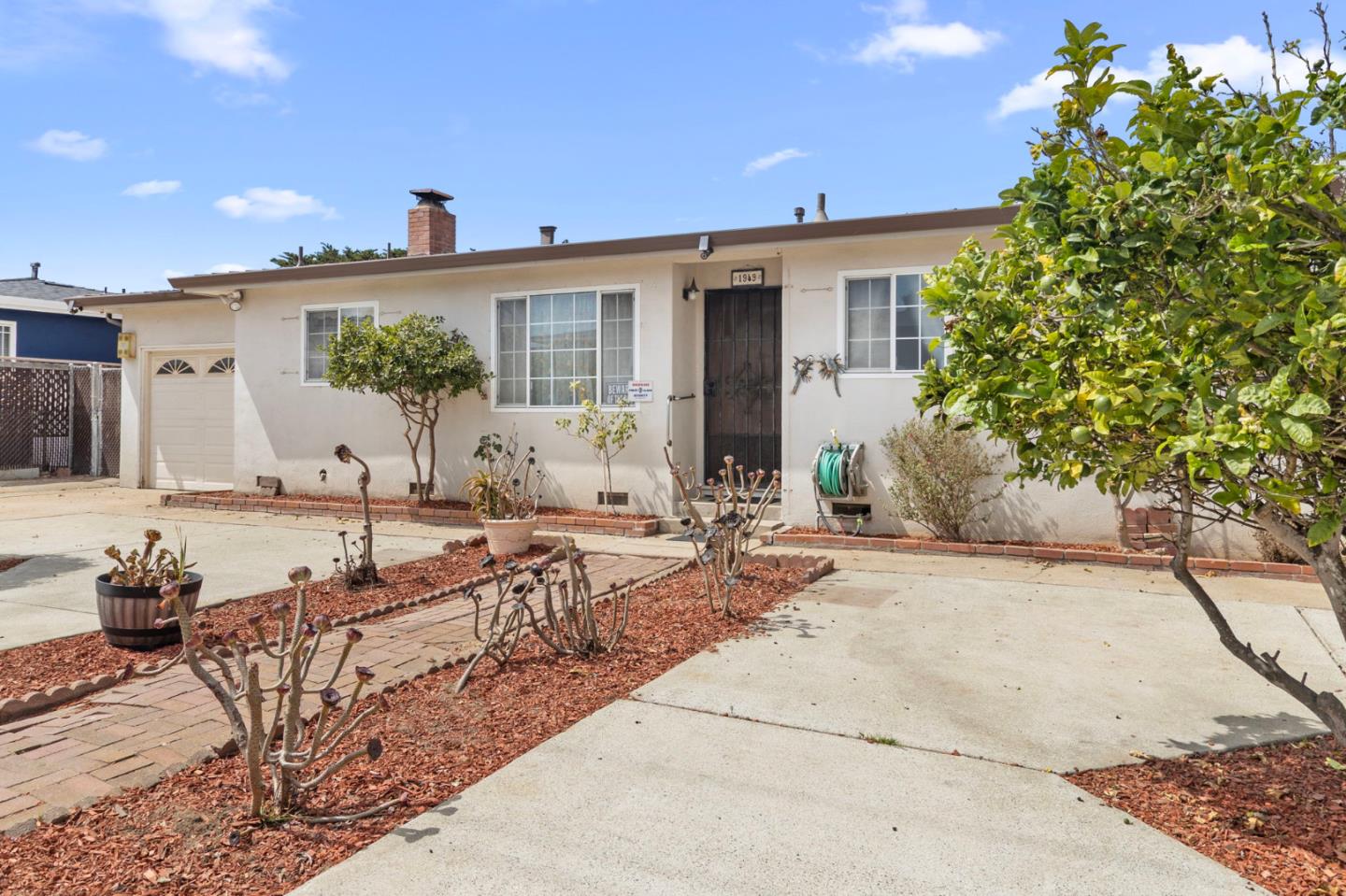 1949 Lincoln Street Seaside, CA 93955 - Photo 5 of 40 a view of a house with backyard and sitting area