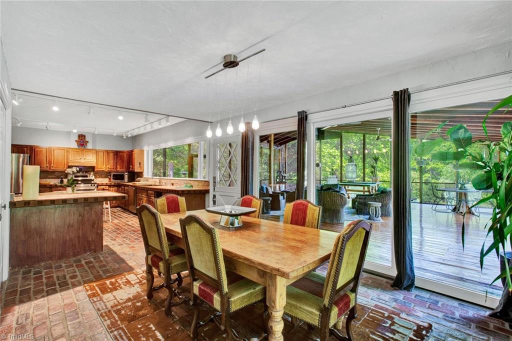 7762 Eversfield Road Summerfield, NC 27358 - Photo 21 of 30 Dining Area looking to the the Kitchen and Screened Porch!