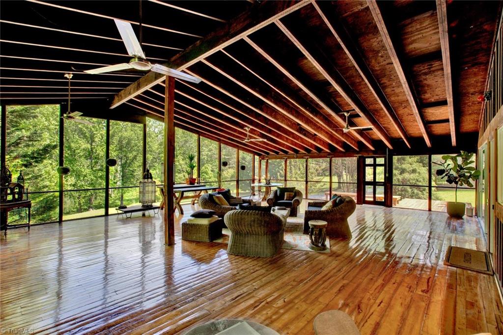 7762 Eversfield Road Summerfield, NC 27358 - Photo 22 of 30 HUGE SCREENED PORCH! It's 36'x30' with view of the 12 acres Pond in the rear!