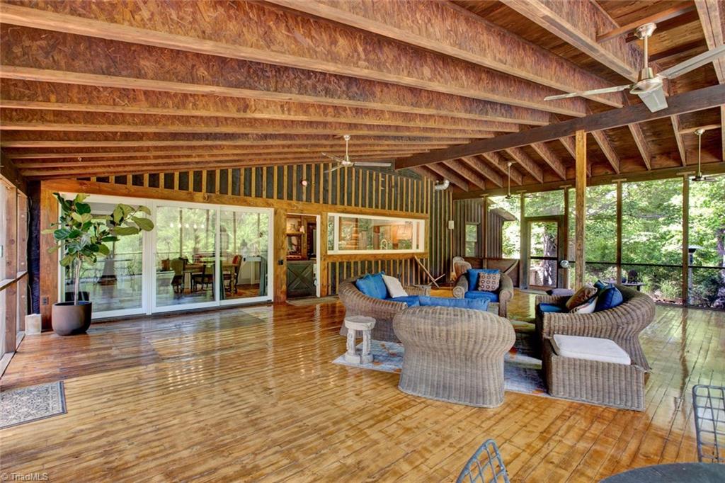 7762 Eversfield Road Summerfield, NC 27358 - Photo 23 of 30 Screened Porch looking to the Kitchen and huge Glass Doors! Great space to entertain and relax with family and friends!