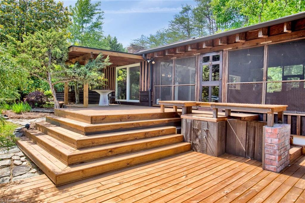 7762 Eversfield Road Summerfield, NC 27358 - Photo 9 of 30 Left side tiered decks and door to huge screened porch!