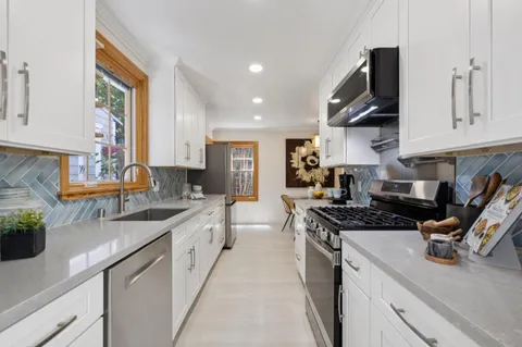 a kitchen with sink and window