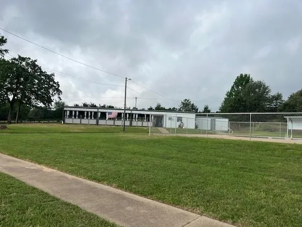 a view of a house with a big yard