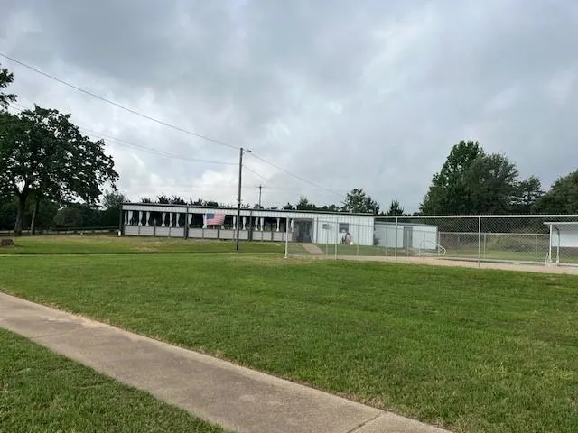 a view of a house with a big yard