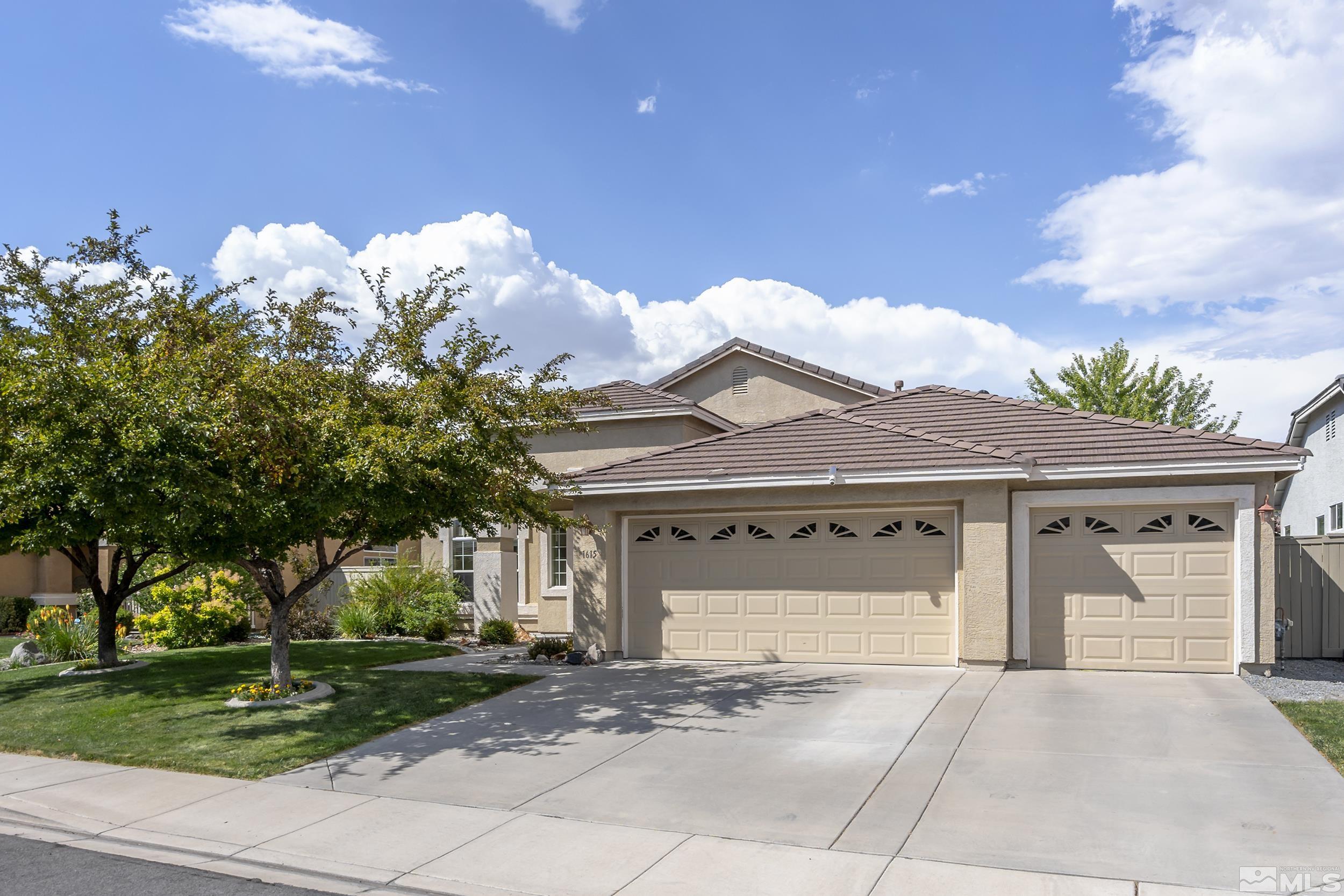 1615 Sewell Drive Reno, NV 89521 - Photo 1 of 25 a front view of a house with garden