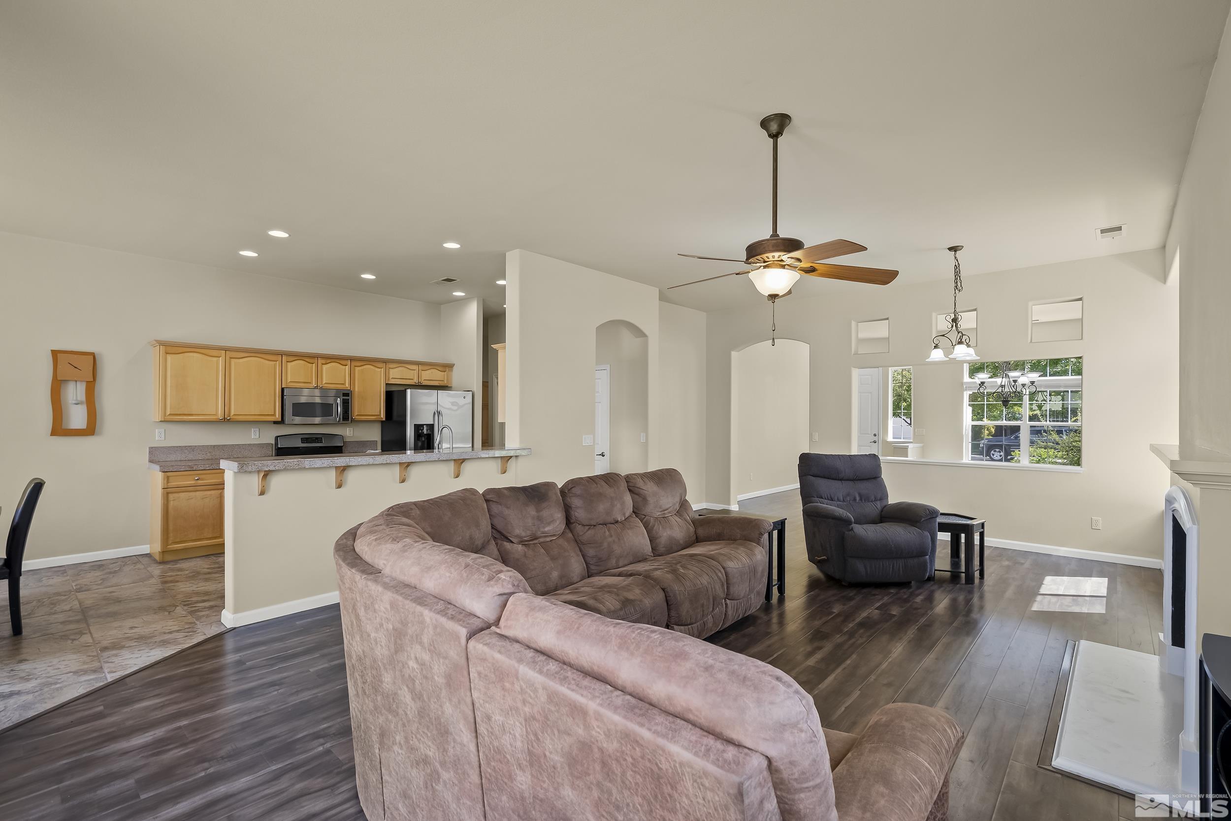 1615 Sewell Drive Reno, NV 89521 - Photo 6 of 25 a living room with furniture and a chandelier