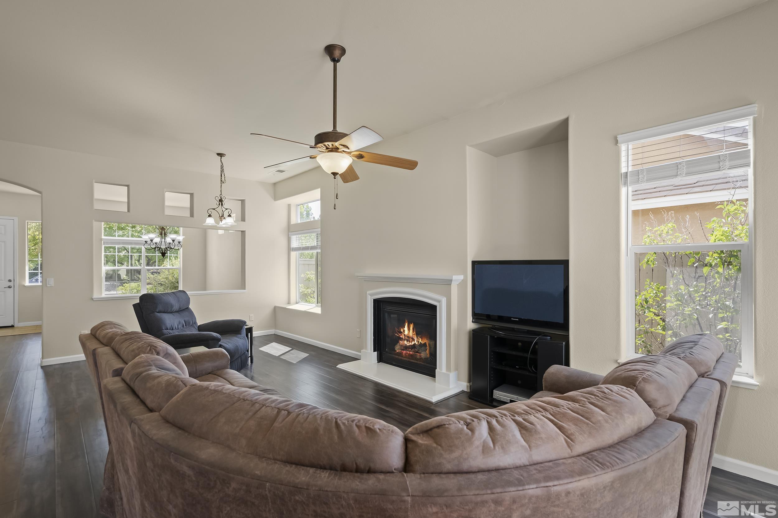 1615 Sewell Drive Reno, NV 89521 - Photo 7 of 25 a living room with furniture and a fireplace