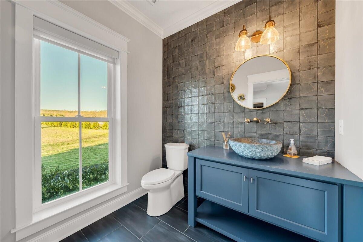 155 Riverview Drive Jasper, TN 37347 - Photo 11 of 100 a bathroom with a granite countertop toilet a sink and a mirror