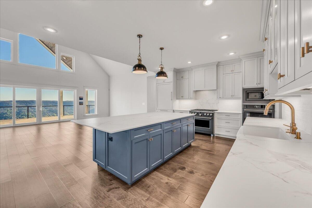155 Riverview Drive Jasper, TN 37347 - Photo 12 of 100 a large kitchen with kitchen island a large counter top stainless steel appliances and cabinets