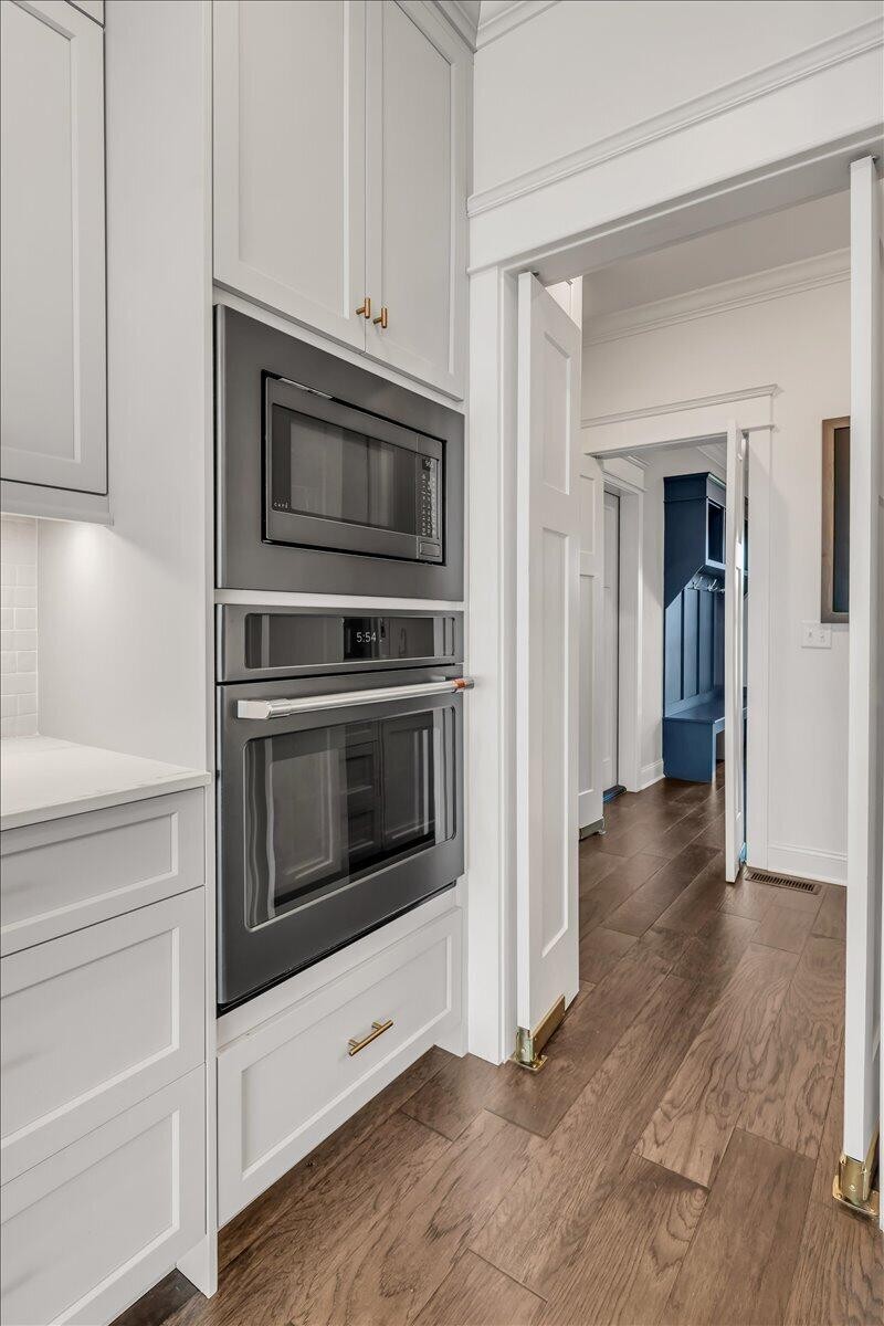 155 Riverview Drive Jasper, TN 37347 - Photo 21 of 100 a kitchen with granite countertop white cabinets and stainless steel appliances