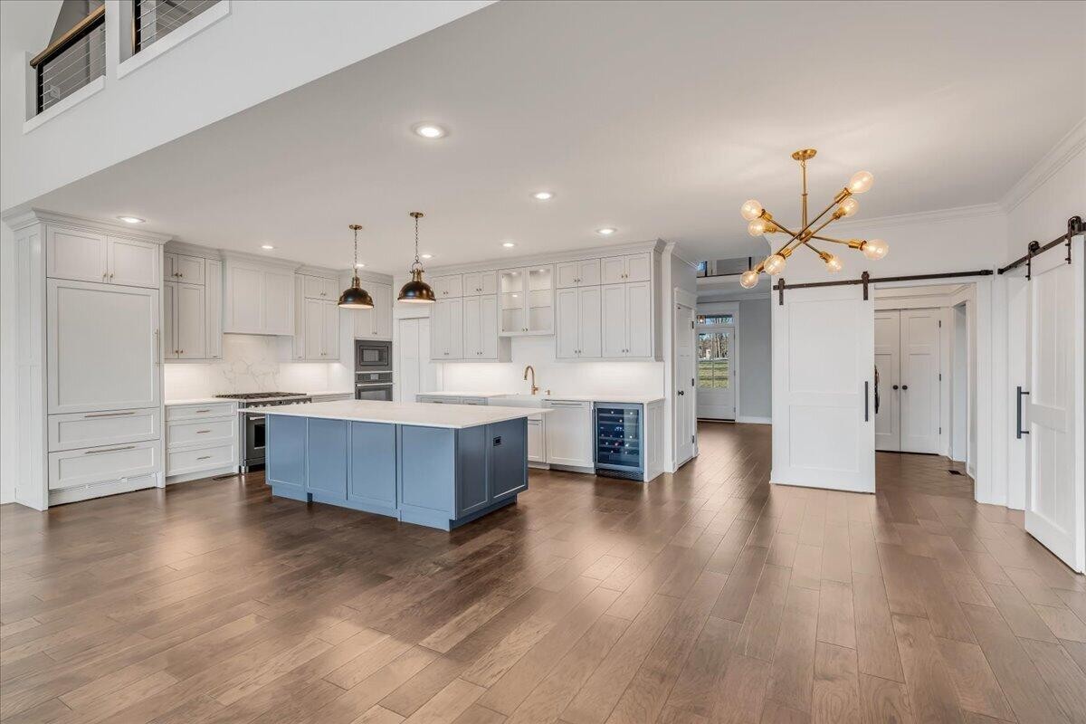 155 Riverview Drive Jasper, TN 37347 - Photo 28 of 100 a large kitchen with a lot of counter space and a wooden floor