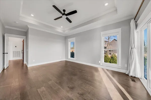 a view of living room with furniture and kitchen view