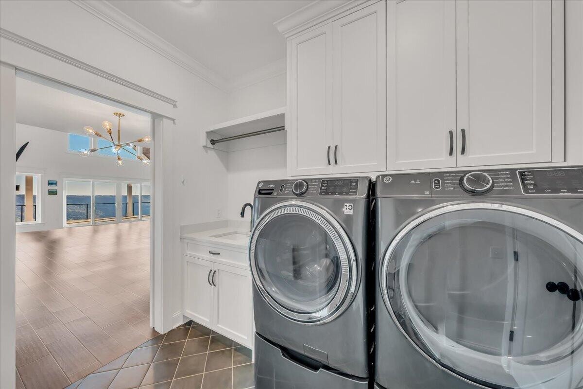 155 Riverview Drive Jasper, TN 37347 - Photo 53 of 100 a utility room with sink dryer and washer
