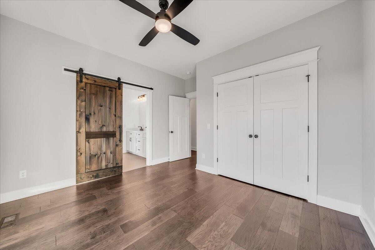 155 Riverview Drive Jasper, TN 37347 - Photo 55 of 100 a view of an empty room with wooden floor