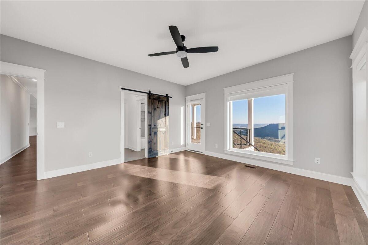 155 Riverview Drive Jasper, TN 37347 - Photo 60 of 100 a view of empty room with wooden floor and fan