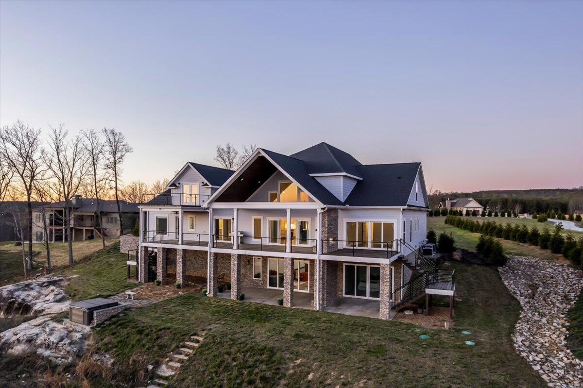 155 Riverview Drive Jasper, TN 37347 - Photo 6 of 100 an aerial view of a house with a garden and balcony