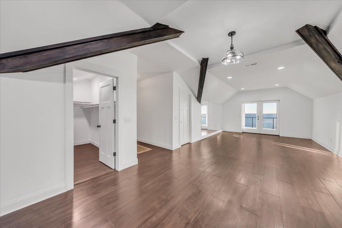 155 Riverview Drive Jasper, TN 37347 - Photo 80 of 100 a view of an empty room with wooden floor and a window