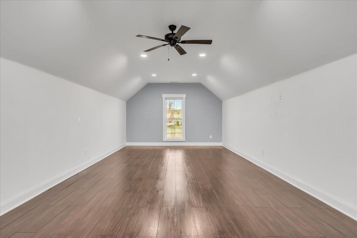 155 Riverview Drive Jasper, TN 37347 - Photo 81 of 100 an empty room with wooden floor fan and windows