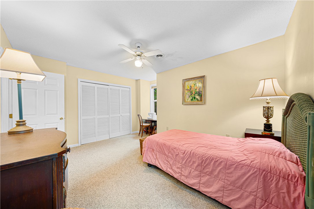 139 Tulip Lane Westminster, SC 29693 - Photo 9 of 37 Well-lit sleeping quarters with a neutral palette and soft, textured carpeting create a peaceful retreat.