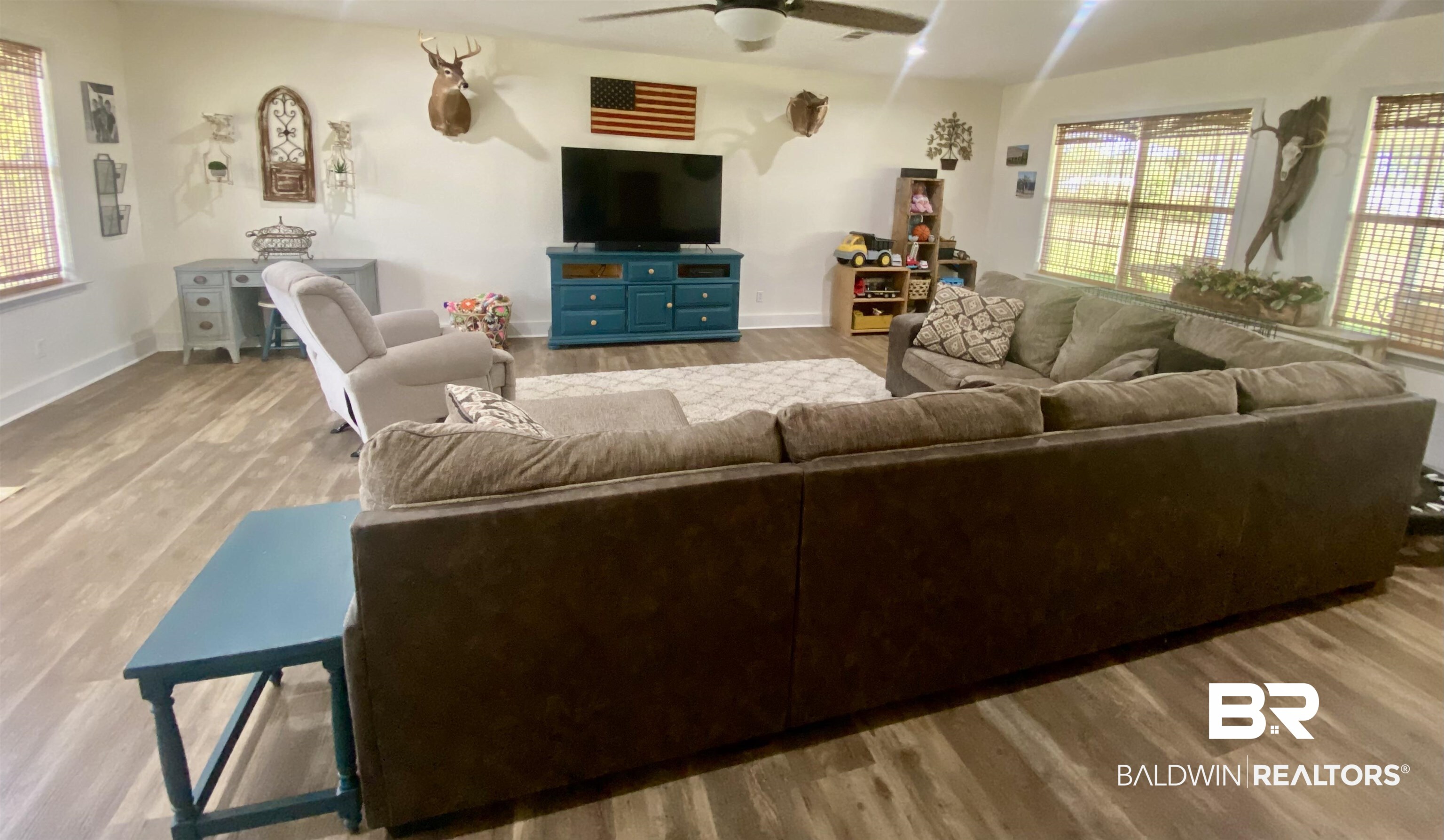 531 Highway 136 Monroeville, AL 36460 - Photo 4 of 48 Living room with plenty of natural light, ceiling fan, and light hardwood / wood-style flooring