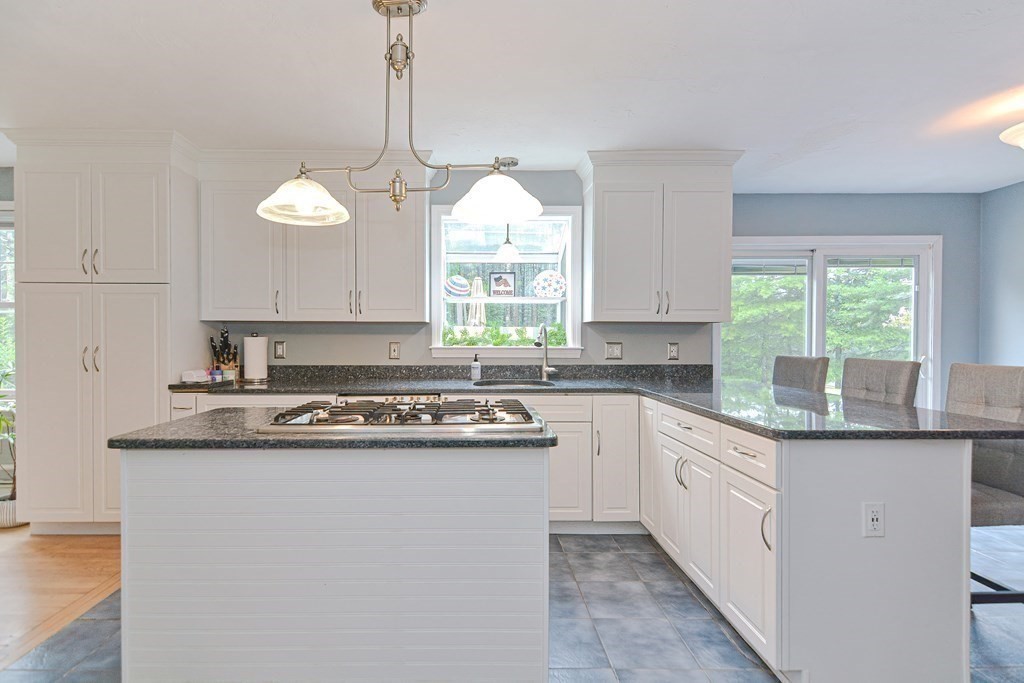 5 Post Road Foxboro, MA 02035 - Photo 13 of 37 a kitchen with a sink window and cabinets