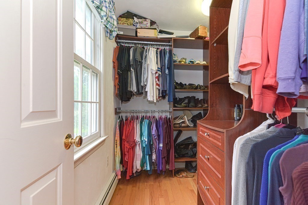 5 Post Road Foxboro, MA 02035 - Photo 19 of 37 a view of walk in closet with clothes and shoes