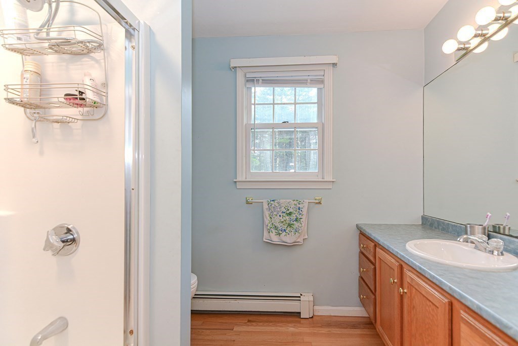 5 Post Road Foxboro, MA 02035 - Photo 20 of 37 a bathroom with a sink a vanity and a mirror