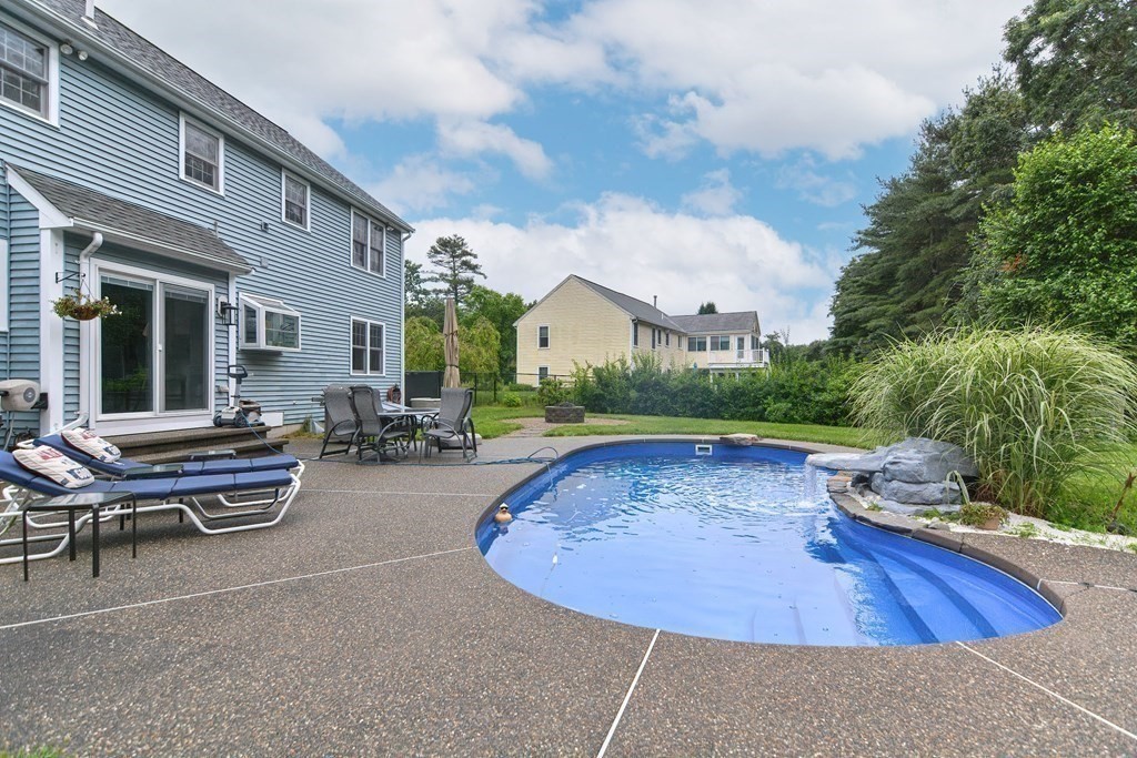 5 Post Road Foxboro, MA 02035 - Photo 2 of 37 a view of a swimming pool with lounge chair