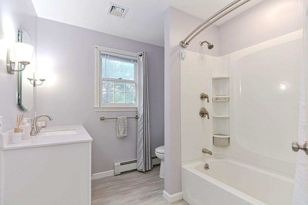 5 Post Road Foxboro, MA 02035 - Photo 23 of 37 a bathroom with a bathtub shower and a sink