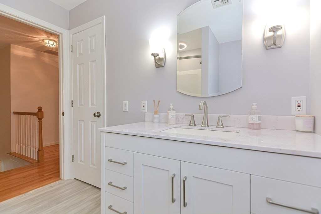 5 Post Road Foxboro, MA 02035 - Photo 24 of 37 a bathroom with a granite countertop sink double and mirror