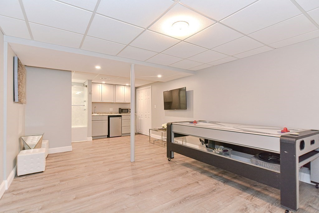 5 Post Road Foxboro, MA 02035 - Photo 34 of 37 a living room with furniture and a flat screen tv