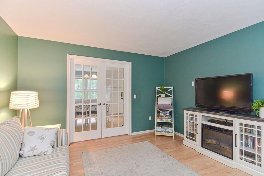 5 Post Road Foxboro, MA 02035 - Photo 7 of 37 a living room with furniture and a flat screen tv