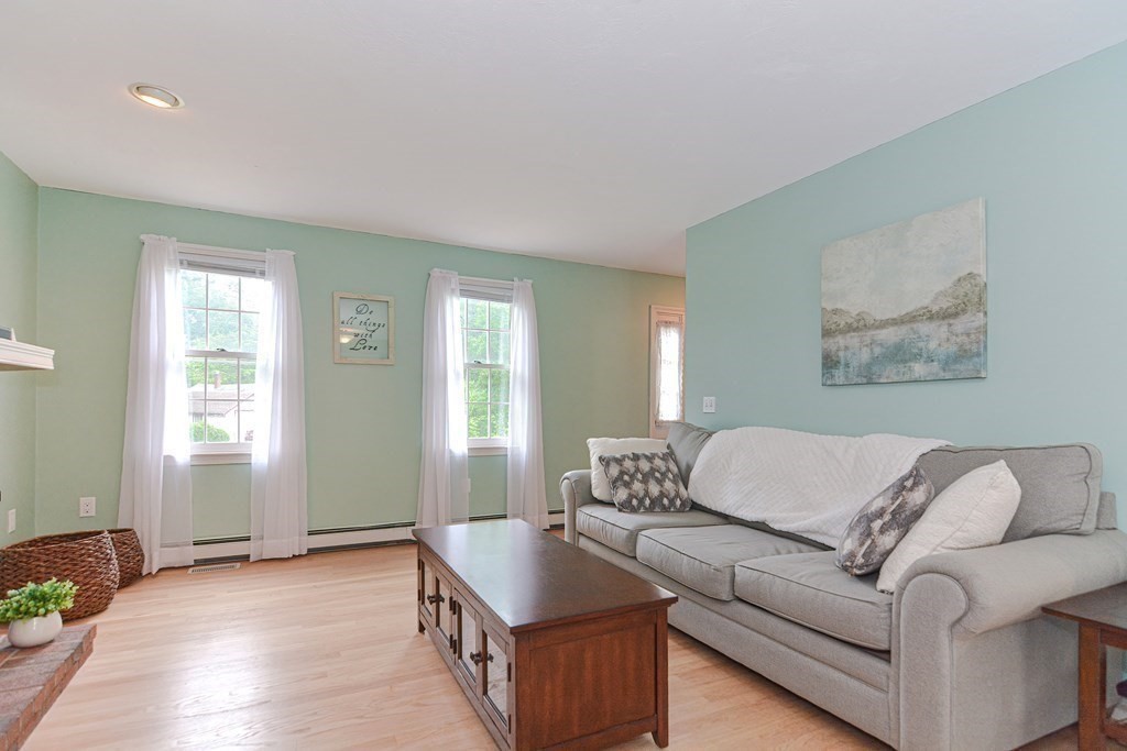 5 Post Road Foxboro, MA 02035 - Photo 8 of 37 a living room with furniture and a potted plant