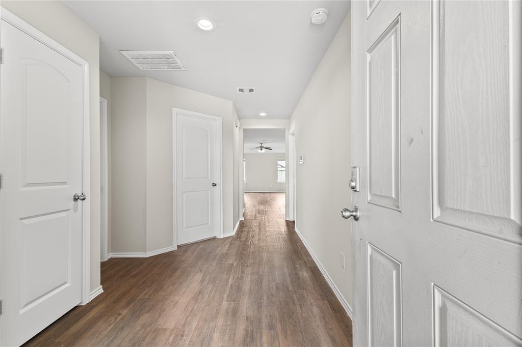 15454 Arce Rojo Street Channelview, TX 77530 - Photo 5 of 32 Corridor with recessed lighting and dark wood-type flooring