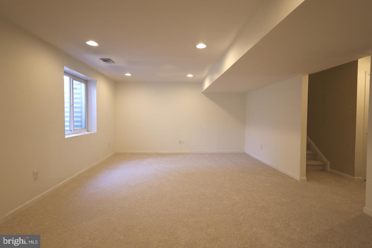 404 Leo Lane Bear, DE 19701 - Photo 16 of 18 an empty room with windows and closet