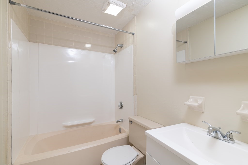 24 Bettys Pond Road, Unit K Barnstable, MA 02601 - Photo 14 of 16 a bathroom with a sink toilet and shower