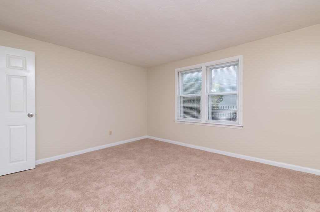 24 Bettys Pond Road, Unit K Barnstable, MA 02601 - Photo 9 of 16 an empty room with windows