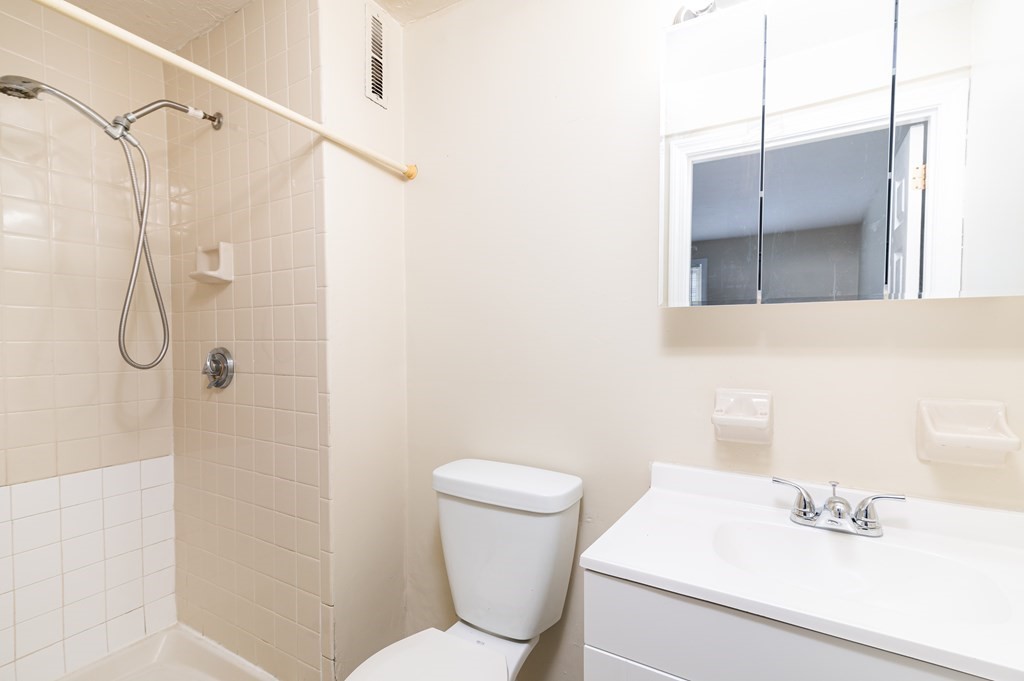 24 Bettys Pond Road, Unit K Barnstable, MA 02601 - Photo 10 of 16 a bathroom with a sink toilet and shower