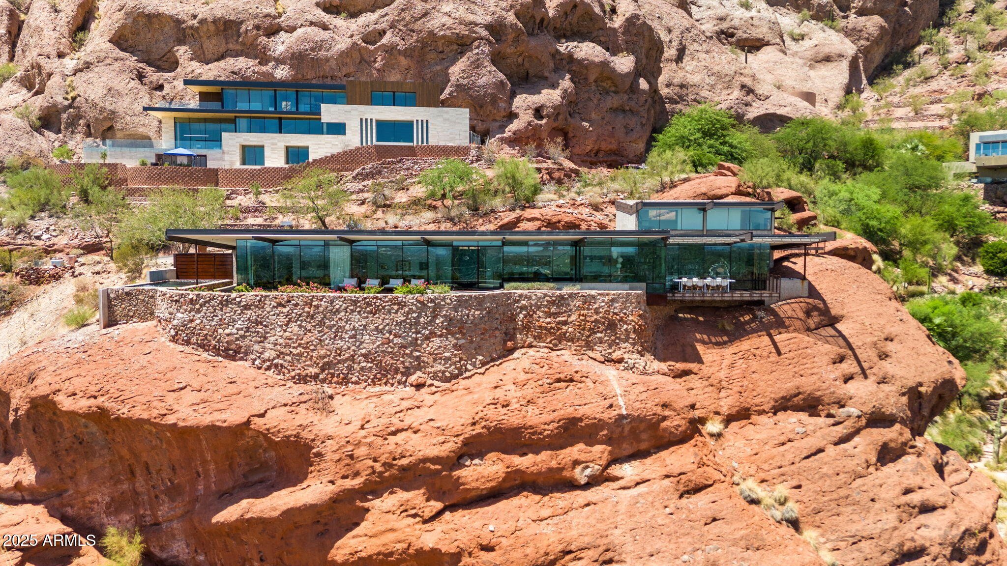4925 East Red Rock Drive, Unit 43 Phoenix, AZ 85018 - Photo 2 of 99 a view of a lake with a house in the background
