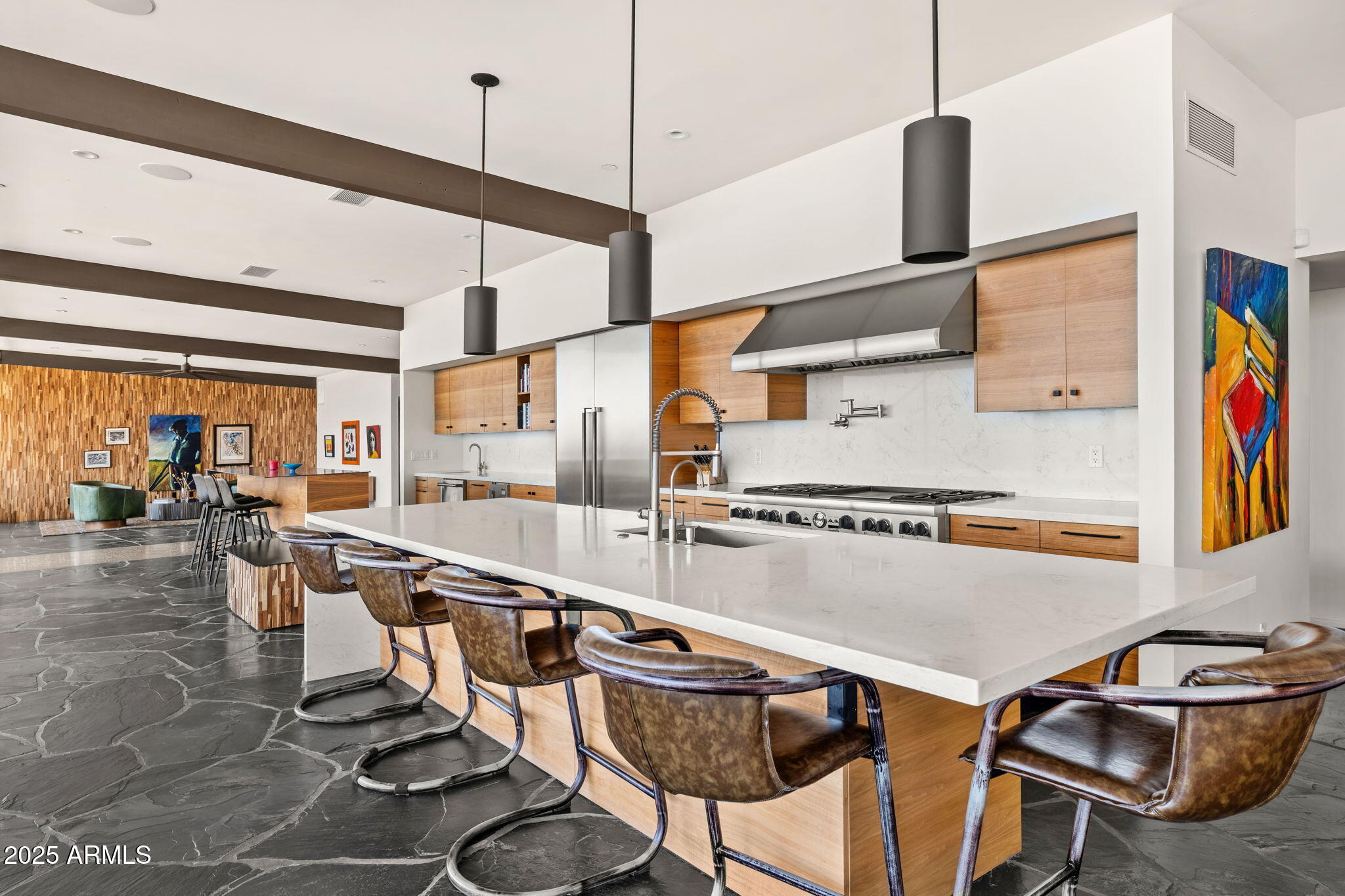 4925 East Red Rock Drive, Unit 43 Phoenix, AZ 85018 - Photo 24 of 99 a kitchen with stainless steel appliances granite countertop a sink and chairs