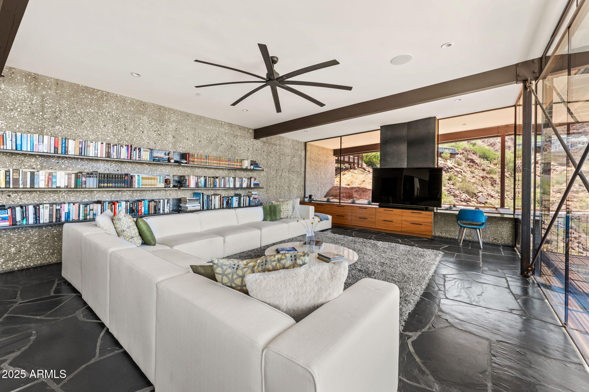 4925 East Red Rock Drive, Unit 43 Phoenix, AZ 85018 - Photo 26 of 99 a living room with furniture and a flat screen tv