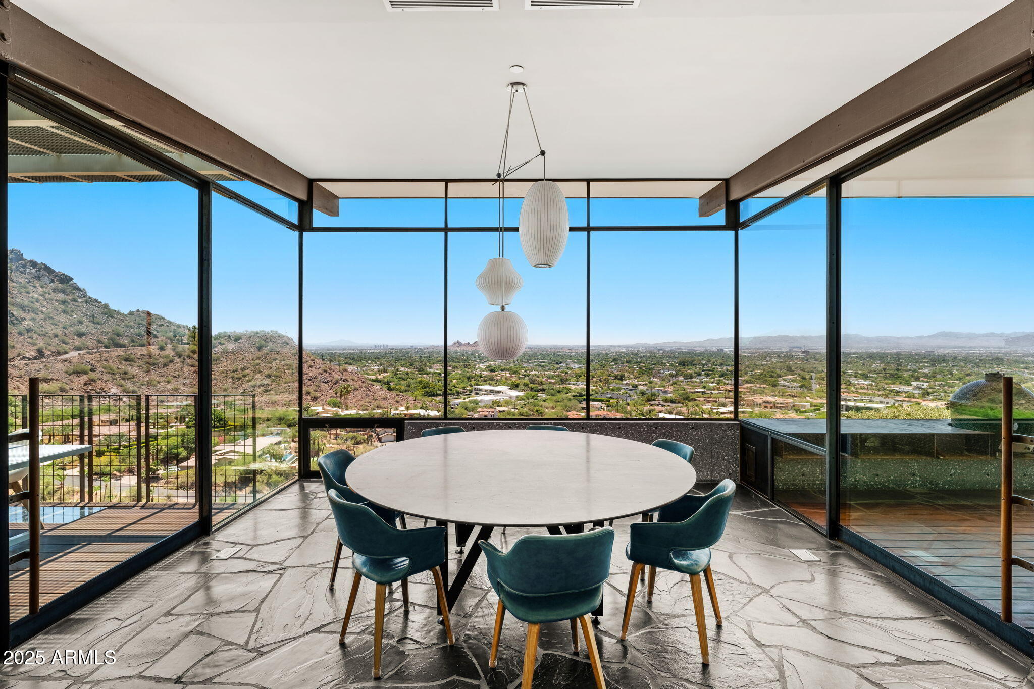 4925 East Red Rock Drive, Unit 43 Phoenix, AZ 85018 - Photo 27 of 99 a view of a city from a dining room
