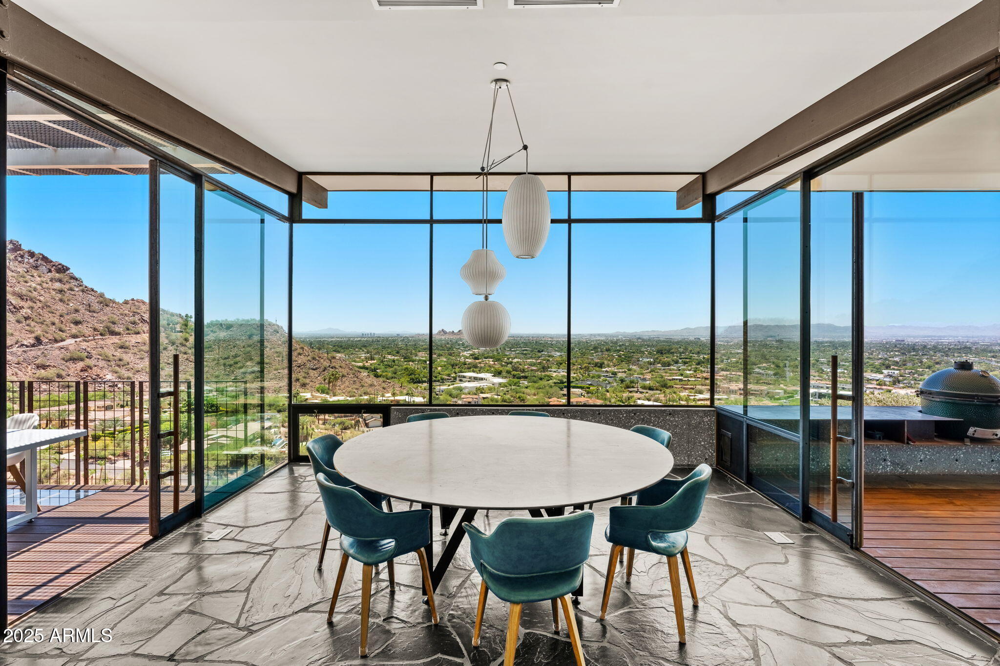 4925 East Red Rock Drive, Unit 43 Phoenix, AZ 85018 - Photo 28 of 99 a view of a city from a dining room