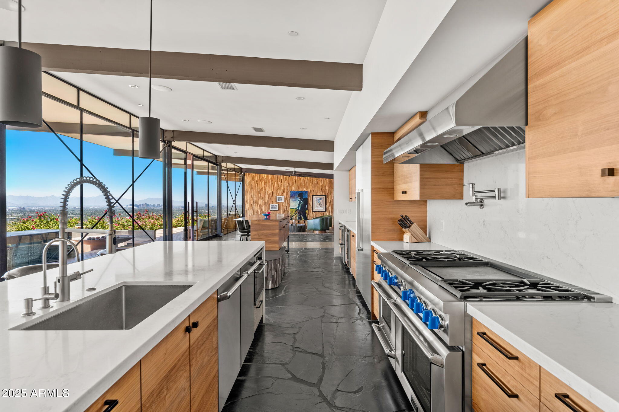 4925 East Red Rock Drive, Unit 43 Phoenix, AZ 85018 - Photo 30 of 99 a kitchen with stainless steel appliances granite countertop a sink a stove and a wooden floors