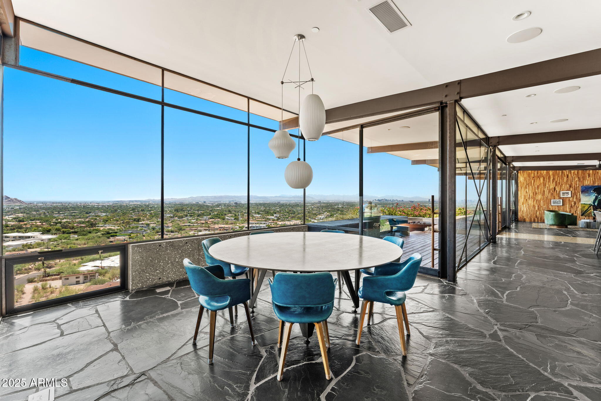 4925 East Red Rock Drive, Unit 43 Phoenix, AZ 85018 - Photo 31 of 99 a dining room with furniture and large windows