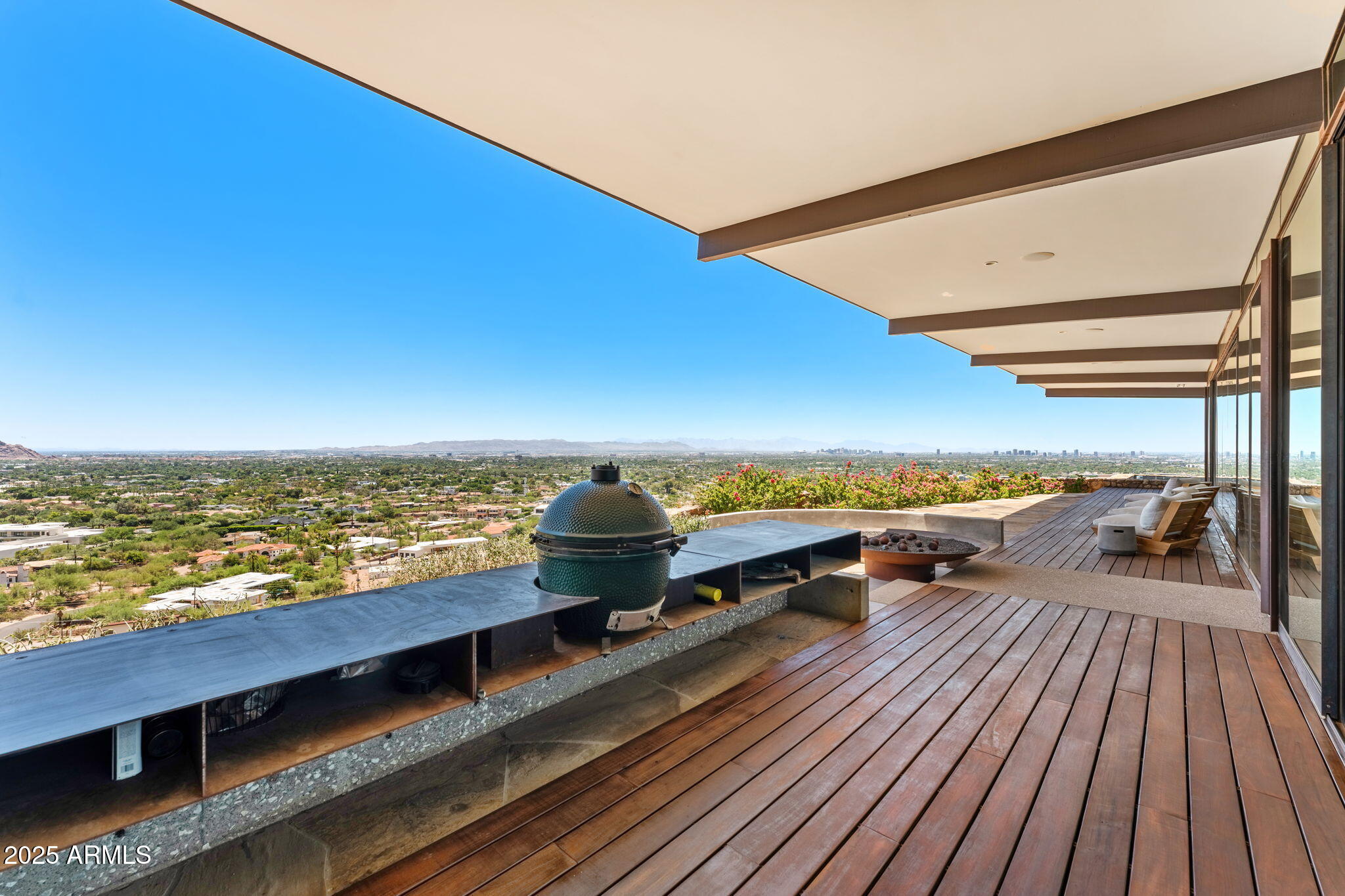 4925 East Red Rock Drive, Unit 43 Phoenix, AZ 85018 - Photo 36 of 99 a view of a balcony with wooden floor and outdoor space