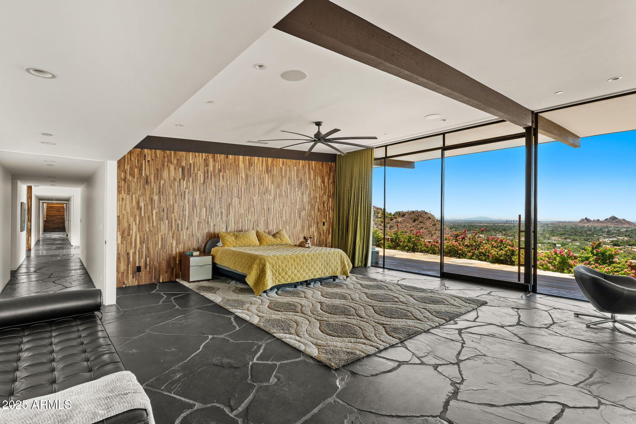 4925 East Red Rock Drive, Unit 43 Phoenix, AZ 85018 - Photo 43 of 99 a bedroom with a bed and a couch