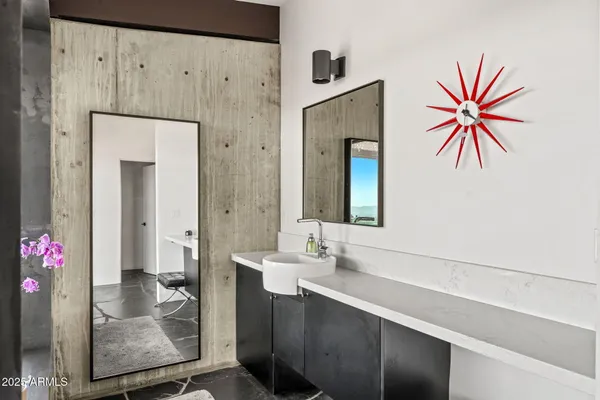 a room with wooden floor and white appliances