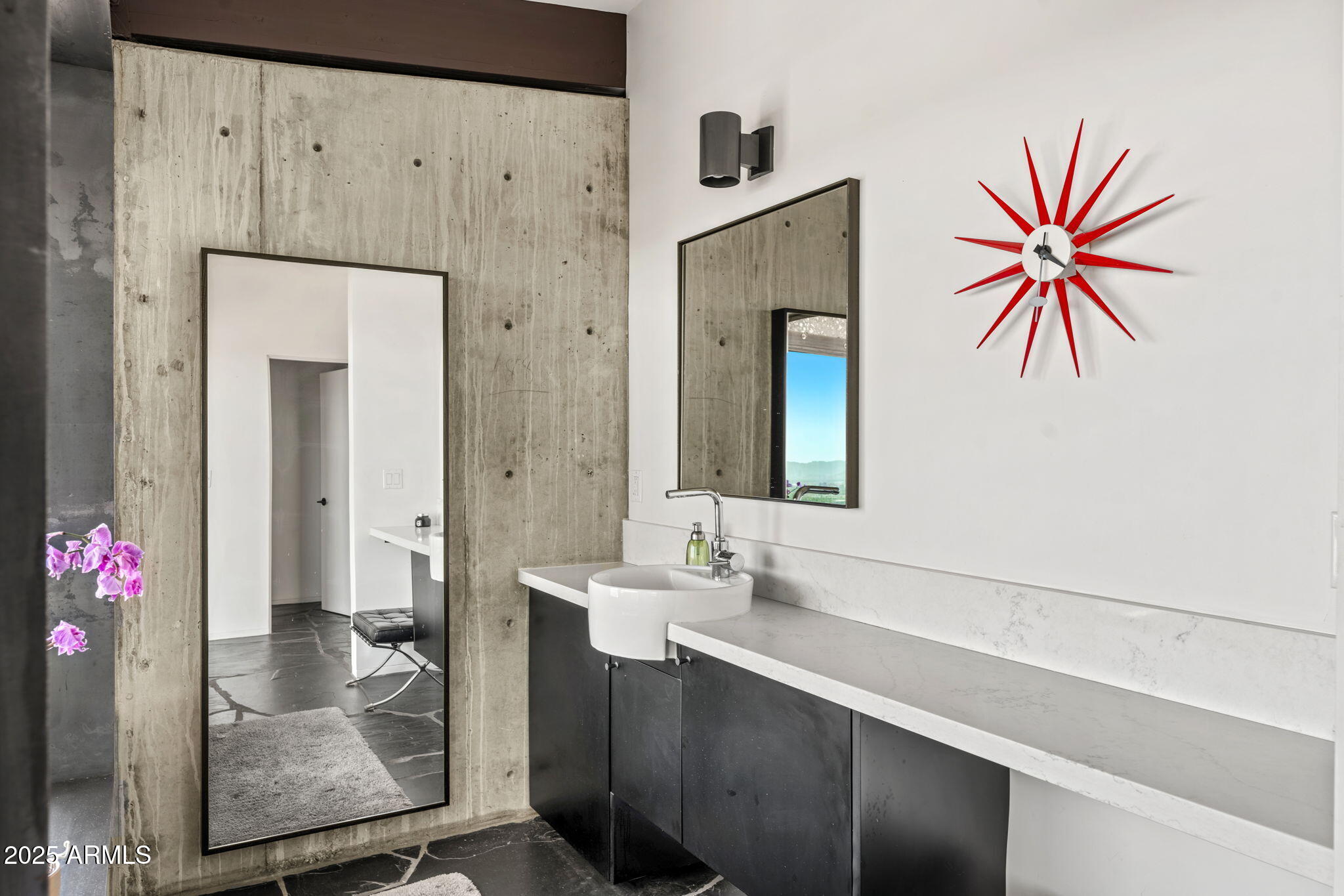 4925 East Red Rock Drive, Unit 43 Phoenix, AZ 85018 - Photo 46 of 99 a bathroom with a sink and a mirror